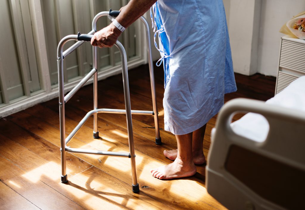 Adult in hospital with a walking frame
