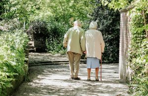 Two older people walking